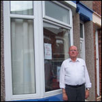 Eddie outside his house